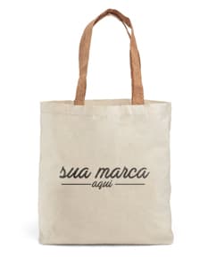 Sacola de algodão marrom com alças de cortiça, vazia e aberta. O design é elegante e moderno, perfeito para compras ou presentes. O material é resistente e possui um detalhe de padlock para segurança. A textura é vintage e grunge, dando um toque de estilo retro.