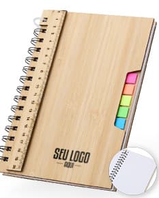 Caderno A5 Bambu em textura de bambu, aberto e com páginas em branco. Possui régua de medição, instrumento de medição, notebook, papel, anotações, espaço para escrever e design clean. Ideal para estudo, trabalho ou projetos.