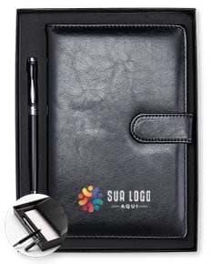 Kit Executivo 2 Peças: inclui uma pasta de couro marrom e uma caneta de luxo prateada.