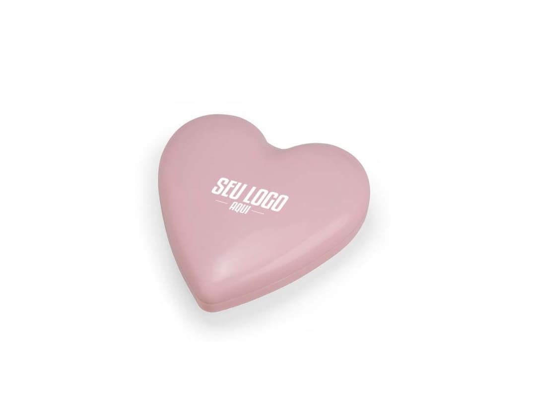 Escova com espelho em um cabo de plástico na cor rosa. O espelho está preso na parte de trás da escova.