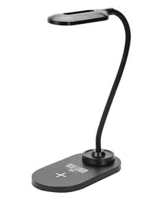 Luminária Led Carregamento via Indução em uma mesa branca, iluminando o ambiente de forma suave e eficiente.