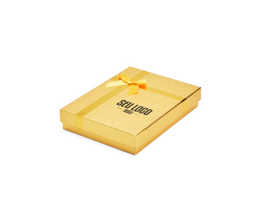 Caixa de presente na cor vermelha, com laço dourado e pequenos detalhes brilhantes.