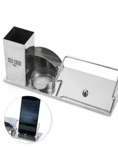 Produto Kit Escritório 4 em 1 com caneta, bloco de notas, porta cartões e porta canetas em mesa de escritório.