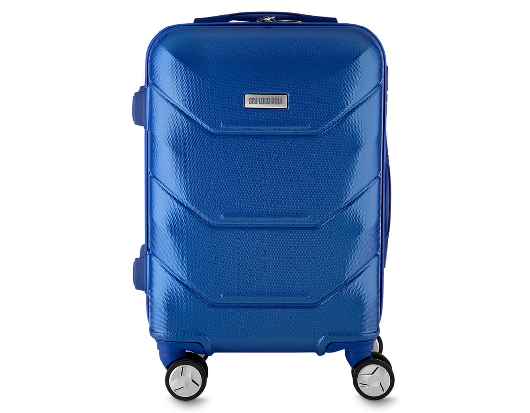 Mala de Viagem em ABS com Divisória em 3D, em destaque em uma loja de tecnologia. A imagem mostra a mala prateada em um carrinho de compras, cercada por equipamentos eletrônicos e tecnológicos, como televisão, câmera, monitor, computador e carrinho de compras vazio. O ambiente é moderno, com destaque para a iluminação e o design contemporâneo.